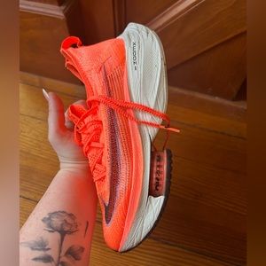 Neon orange Nike Alphafly women’s 7.5